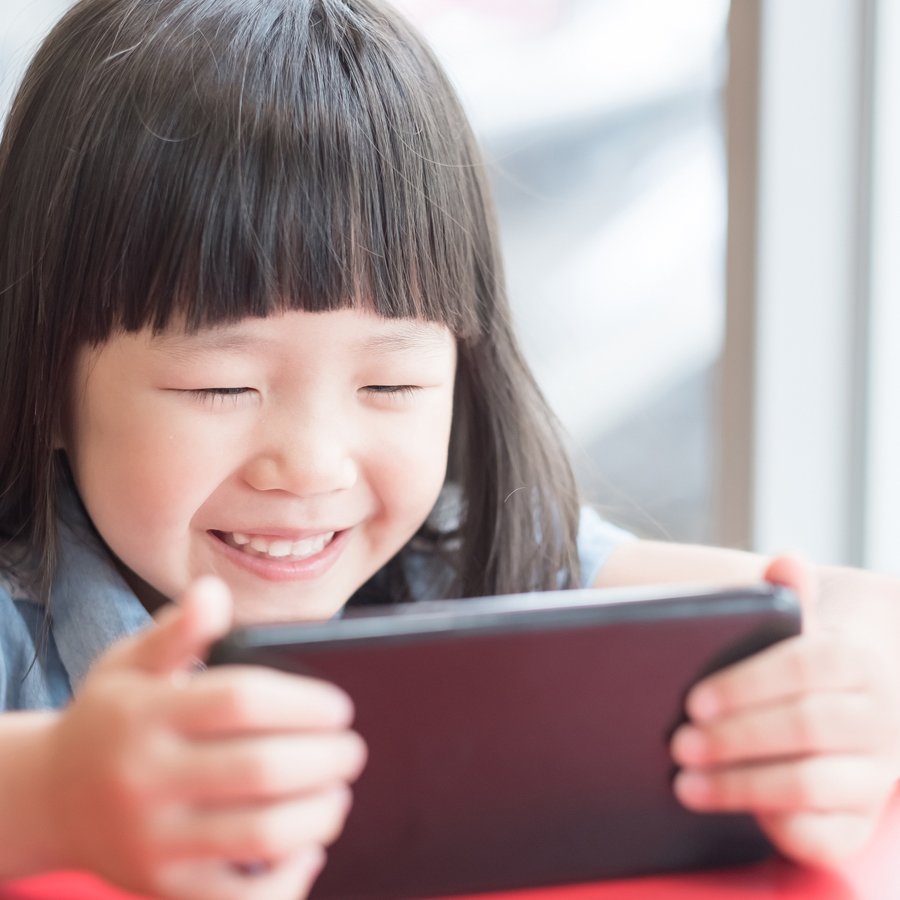 kid playing mobile games